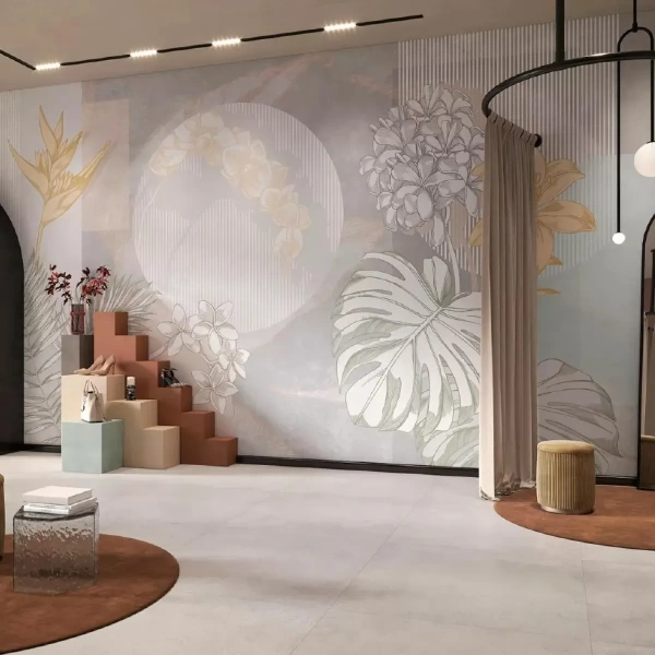 Modern floral mural with tropical leaves in a boutique retail showroom.
