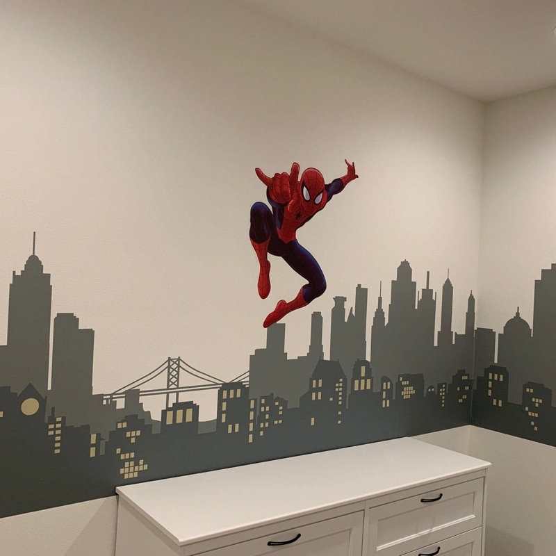 Spider-Man mural over a grey city skyline