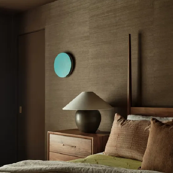 Textured brown grasscloth wallpaper in a modern bedroom